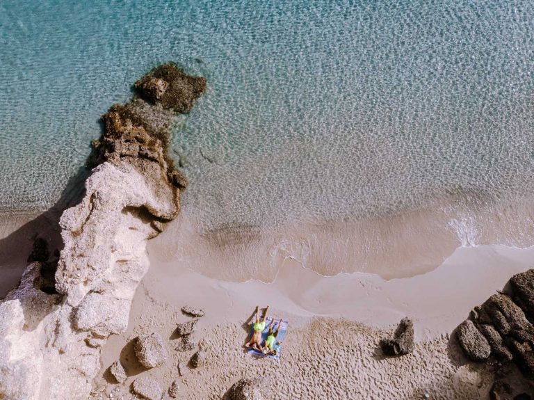 Tow people at a small beach